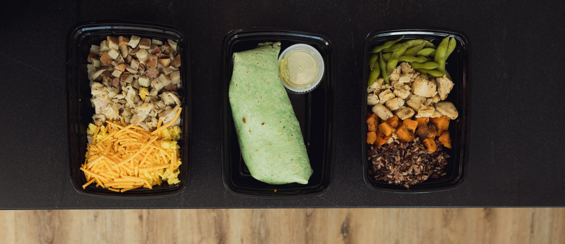 Three meka meals lined up next to each other, chicken hash, burrito, and chicken bowl